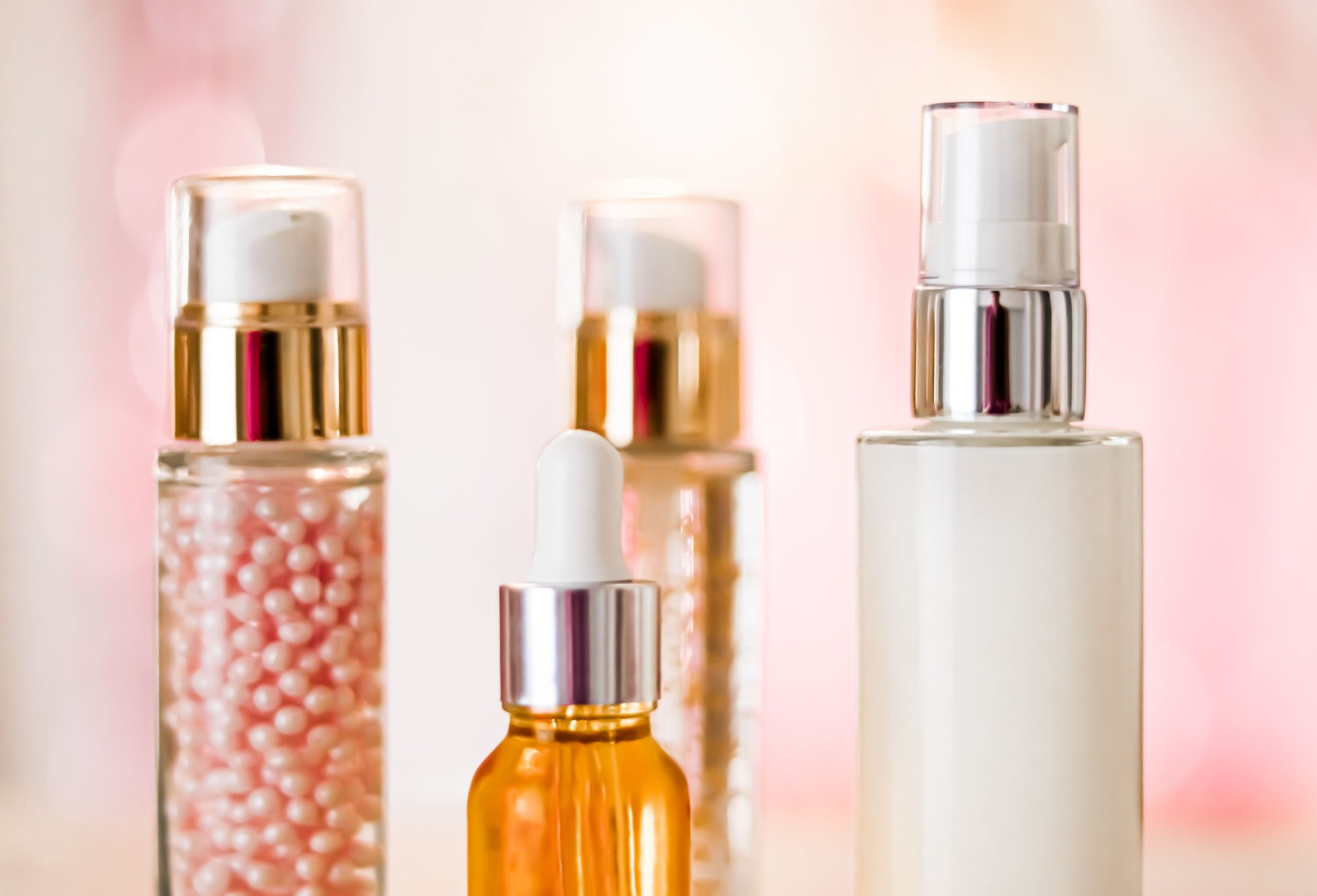 Skincare cosmetics products on glamour background, glass bottles with serum, oil, face cream moisturiser, facial lotion, cleanser as skin care cosmetic set on glossy marble, body care routine and luxury beauty brand